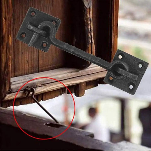 Two Piece Heavy Duty 4 1/2 Inch Sliding Barn Door Hardware Set With Slick Cast Copper Latch Hook And Eye Lock Rust Resistant For Straight Up Secure Wood Doors mounted on a wooden door.