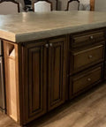 Pro Grade Water Based Concrete Countertop Sealer Kit Food Safe Formula Delivers A Crisp Semi Gloss Finish With Tough Acrylic Polymer applied to kitchen island.