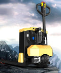Hefty 6600 Lb Manual Pallet Jack Truck With Lithium Battery Power For Heavy Duty Warehouse Jobs showing rear view on rocky terrain.