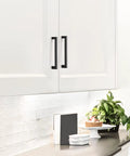 Matte Black Square Cabinet Handles Set for Kitchen Drawers 7.5 Inch Hole Centers 8 Inch Total Length 1.4 Inch Diameter installed on white cabinets