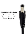 Close-up of 9V 300mA power supply connector 5.5x2.1mm tip negative for electric guitar effects pedals, shows polarity.