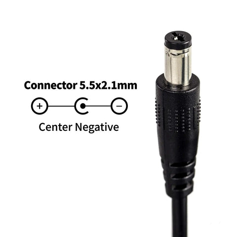Close-up of 9V 300mA power supply connector 5.5x2.1mm tip negative for electric guitar effects pedals, shows polarity.