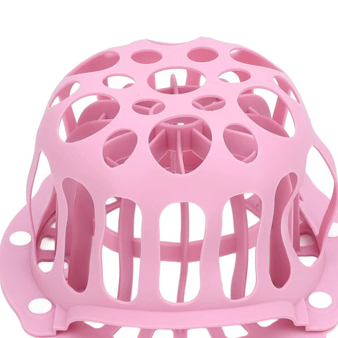 Close-up of pink Silicone Hat Washing Cage For Machine Wash, Reusable Cap Washer Bag That Prevents Deformation and hat loss.