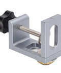 Professional Aluminum Doweling Jig Kit For Woodworkers Featuring Slick Setup And Dead Nut Hole Locator Accuracy With 8mm 10mm 12mm Drill Bits And Sleeves Perfect Clamping Guide close-up of aluminum doweling jig with adjustment knob and clamp.