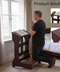 Solid Wood Prayer Kneeler Bench With Soft Kneeling Pad Cozy Home Church Stool With Built In Book Shelf Ergonomic Sturdy Kneeling Prayer Seat For Daily Devotion And Bible Reading in brown, shown with a person kneeling in a home setting.