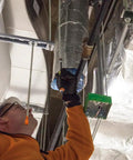 Worker using Heavy Duty Magnetic Nut Driver Set With Through Handle And Hollow Shafts Color Coded for Quick Size ID