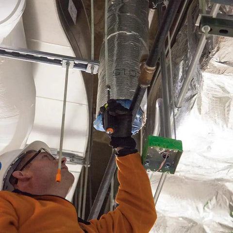 Worker using Heavy Duty Magnetic Nut Driver Set With Through Handle And Hollow Shafts Color Coded for Quick Size ID