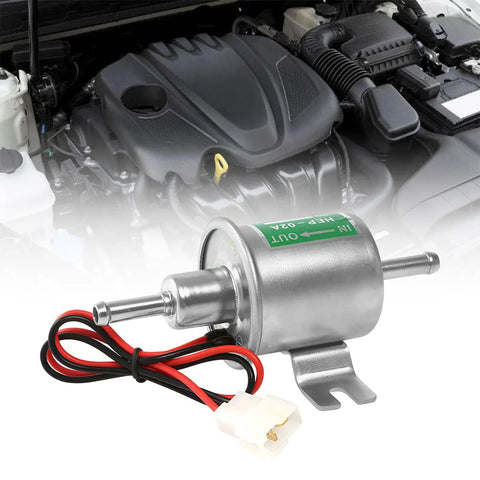 12V Heavy Duty Inline Fuel Pump For Lawn Mowers And Cars Universal Low Pressure Transfer Pump For Gas And Diesel Engines Built From Copper Clad Aluminum Corrosion Resistant Durable Performance Ready Silver Finish shown in front of car engine