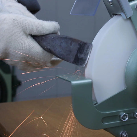 Heavy Duty 6 Inch Bench Grinder Wheels 80 Grit White Aluminum Oxide Vitrified Ceramic Stones sharpening a tool with sparks.