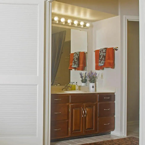 Six Light Vanity Light Bar Dimmable Polished Chrome Boss Vibe mounted horizontally above bathroom mirror