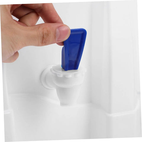 Hand operating blue faucet of Portable Water Dispenser And Compact Bucket Holder Faucet For Outdoor Camping And RV Use