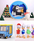 Decorative holiday scene with festive characters and a toy delivery truck.