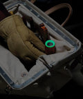 Worker placing a Rechargeable LED Flashlight With Flood Light 500 Lumens USB C Rechargeable Magnetic End Cap in a tool bag