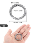 Hand holding Bike Crank Ball Bearings 3 Sixteenth Inch 4 Mm Size, ring dimensions shown, 10 Pcs Replacement Bottom Bracket Bearings Kit.