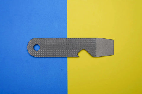 Ultra Slim Pry Bar Keychain Tool Pocket Titanium Multitool for Everyday Carry on blue and yellow background