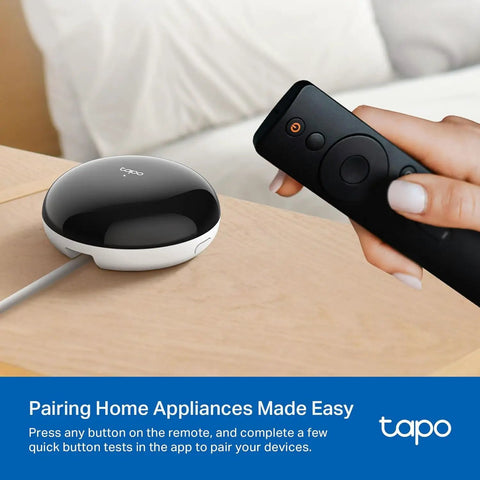 Person using remote with Smart IR And IoT Hub With Chime Universal Remote For TVs, ACs, Fans, And 18 Plus Devices, Matter Certified.