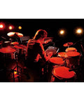 Musician playing HPD-20 Digital Hand Percussion Instrument With 850 Dope Ready To Play Sounds on stage with red lighting.