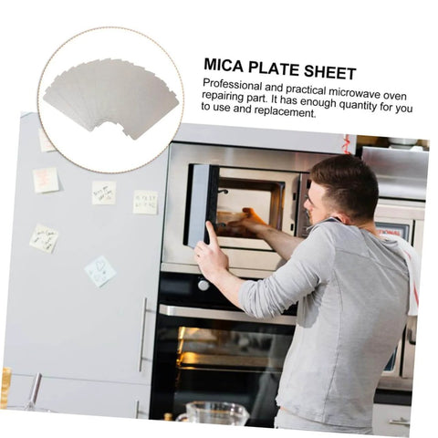 Man installing six piece microwave waveguide mica sheet set for heat insulation and fire retardant covers in microwave oven