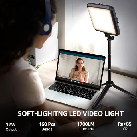 Person using Two Pack 8 Inch Dope LED Video Lights with 29 Inch Adjustable Tripods for Zoom call, soft light illuminating face.