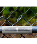 2 Pack Top Rail Fence Sleeve Fits One And Three Eighths Inch OD Rails Six Inch Long Chain Link Fence Top Rail Adapter Tube Connector Steel Construction Easy No Drill No Fuss Install shown installed on a fence.