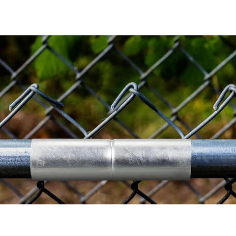 2 Pack Top Rail Fence Sleeve Fits One And Three Eighths Inch OD Rails Six Inch Long Chain Link Fence Top Rail Adapter Tube Connector Steel Construction Easy No Drill No Fuss Install shown installed on a fence.