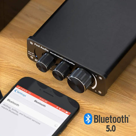 BT10A Bluetooth 5.0 Stereo Amplifier Receiver 2 Channel Class D Mini Hi Fi Integrated Amp for home passive speakers 50W x 2 shown with phone