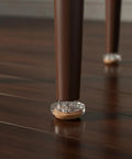 Chair leg with Floor Saver Brown Self Adhesive Felt Pads With Durable PP Base Furniture Glides on hardwood floor