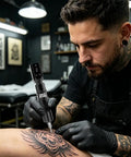 Artist using Wireless Tattoo Pen Kit For Beginners With 10 Tattoo Needles And 5 Ink Colors indoors creating tattoo art