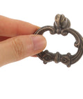 Hand holding Old-School Alloy Pull Handles For Jewelry Box, Cabinet And Drawer, 4 Pack European Style Antique Bronze Round Ring Door Knob