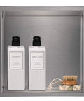 Recessed Shower Niche Organizer In Brushed Nickel Stainless Steel, 12 By 12 In, Rustproof 304 Steel, with shampoo and soap inside.
