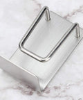 Rock Solid Stainless Steel Bathroom Hook With Tight Suction Mount For Hanging Towels And Scrub Brushes Heavy Duty Wall Organizer No Fuss Setup Dependable Grip For Daily Household Use, top view of sleek design.