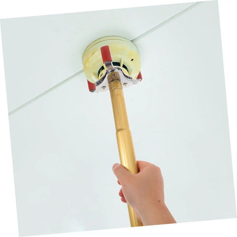 Dead Simple Fire Alarm Removal Tool With Long Extendable Pole in use detaching a ceiling smoke sensor.