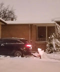 Snow Plow For Cars And ATVs Mounts By Hitch Fold Up Lightweight 78 Inch Curved Blade clearing snow in residential driveway.