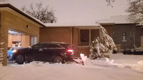 Snow Plow For Cars And ATVs Mounts By Hitch Fold Up Lightweight 78 Inch Curved Blade clearing snow in residential driveway.