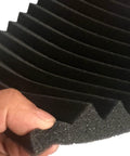Close-up of 52 Piece Black Acoustic Foam Wall Panels With Heavy Duty Mounting Tape, showing wedge design for soundproofing.