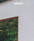 LED Camping Lantern Round Waterproof Portable Tent Light for Hiking and Emergencies hanging in modern patio area.
