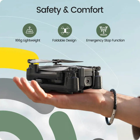 Hand holding foldable FPV drone with 1080P camera for beginners and kids gesture control quadcopter with modular battery.