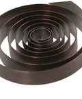 Close-up of 4 Pack Steel Clock Main Springs For Mechanical Clocks Replacement Parts, Windup Power Spring Kit coil.