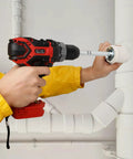 Four Piece PVC Pipe Reamer Set With Socket Saver Heads in use for removing SCH 40 from hub, attached to variable speed drill.