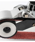 Close-up of Handheld Pipe Belt Sander And Tube Polisher For Circular Grinding And Rust Removal On Round Metal Pipes removing weld scars.