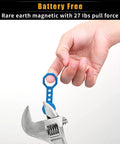 Hand holding blue keychain accessory with No Sweat Heavy Duty Magnetic Stud Finder Wall Scanner near adjustable wrench.