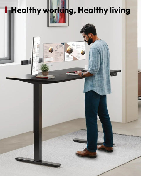 Heavy Duty Dual Motor Electric Standing Desk 71 By 32 Large Height Adjustable Sit Stand Workstation Pro Setup For Home Office Gaming And Daily Grind with dual monitors and plant.