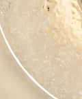Close-up of the textured surface of Wall Sconce Modern Indoor Round LED Nordic Hall Natural Stone Vintage Industrial Hallway Fixture.
