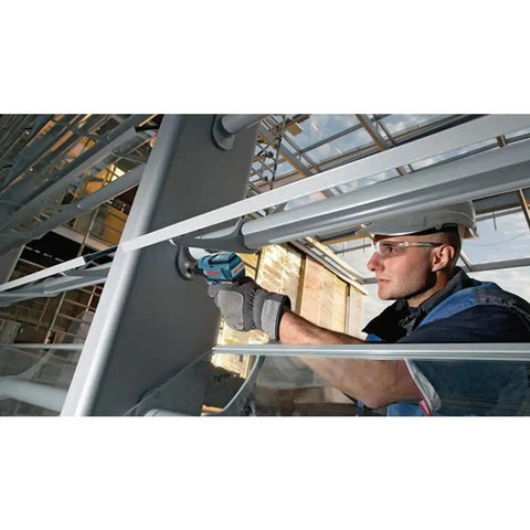 Worker using Compact Lightweight Brushless Cordless Impact Driver Kit With Killer Torque And Efficiency Completes Most Fastening Tasks In A Snap For Pros And Diyers on metal beam