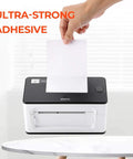 Person inserting a 4x6 thermal direct shipping label into a label printer for easy shipping and fulfillment, text 'Ultra-Strong Adhesive' visible