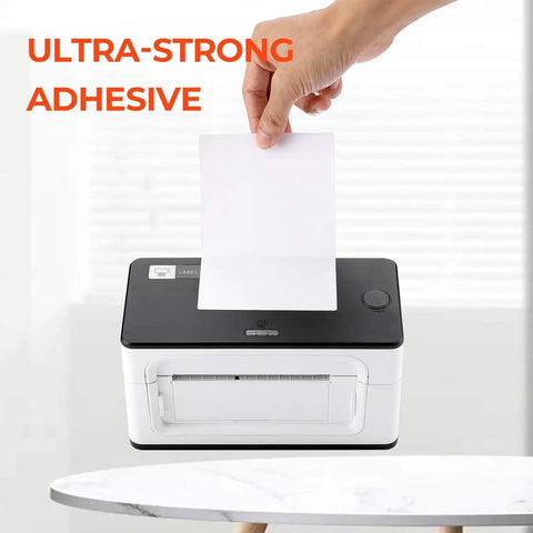 Person inserting a 4x6 thermal direct shipping label into a label printer for easy shipping and fulfillment, text 'Ultra-Strong Adhesive' visible