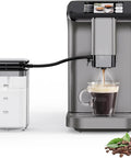 Countertop Ready Dual Boiler Espresso Machine With Built In Grinder And Automatic Milk Frother brewing coffee into a glass cup.