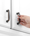 Oil Rubbed Bronze Cabinet Pulls 3 Inch 20 Pack Durable Solid Metal Handles for Kitchen Cabinets in use on white doors.
