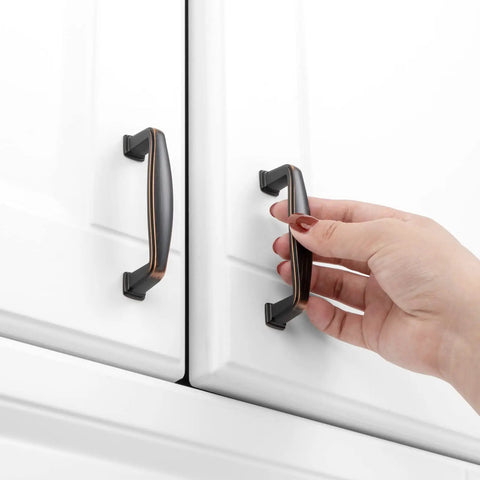 Oil Rubbed Bronze Cabinet Pulls 3 Inch 20 Pack Durable Solid Metal Handles for Kitchen Cabinets in use on white doors.