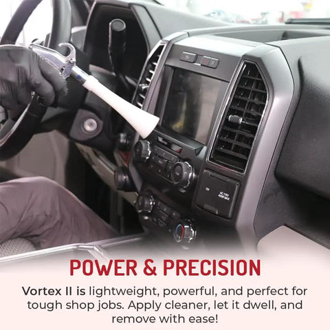 Vortex II Air Cleaning Gun for Auto Detailing in use on car dashboard, showing air-powered blaster cleaning car interior.